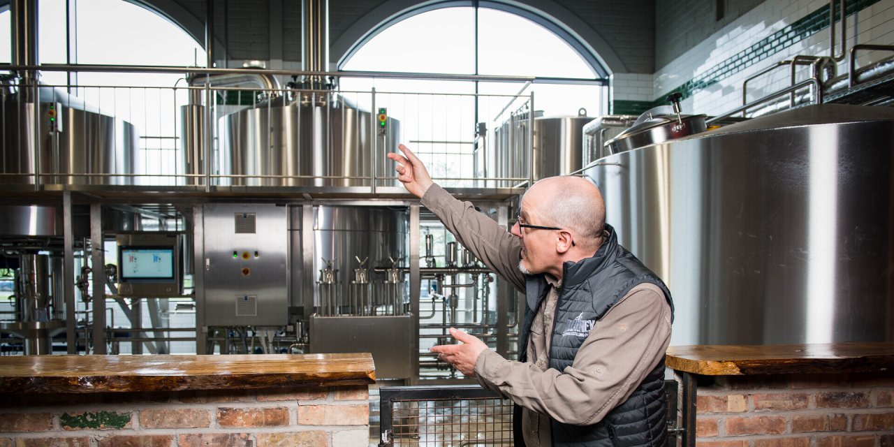 Tour Guide Showing The Process of Brewing